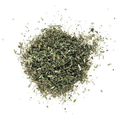 Close-up of Meowijuana Rocky Mountain Mellow catnip blend scattered on a white background.