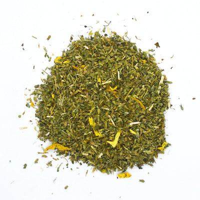 Close-up of Meowijuana's Daydreamer Mix, featuring a blend of chamomile, sunflower petals, and catnip on a white background.