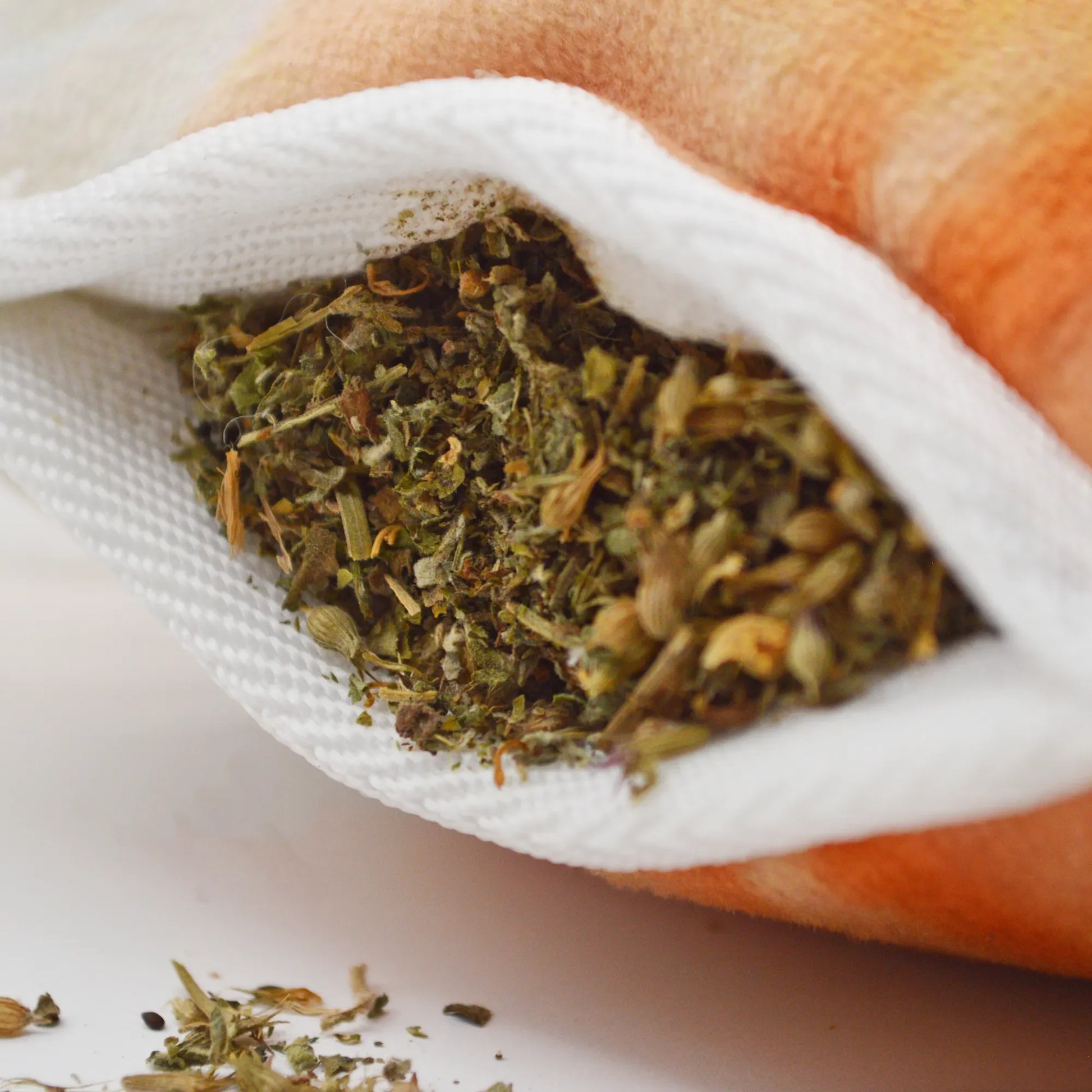 Close-up of the Pumpkin Spice Latte dog toy’s Juananip pocket, showing the herbal blend for calming effects.