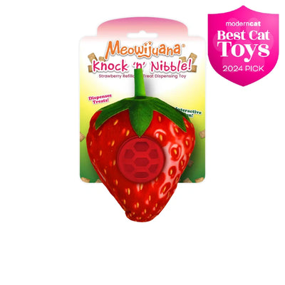 Meowijuana Knock 'n' Nibble strawberry treat-dispensing toy with crinkle sound and refillable treat ball for interactive fun.